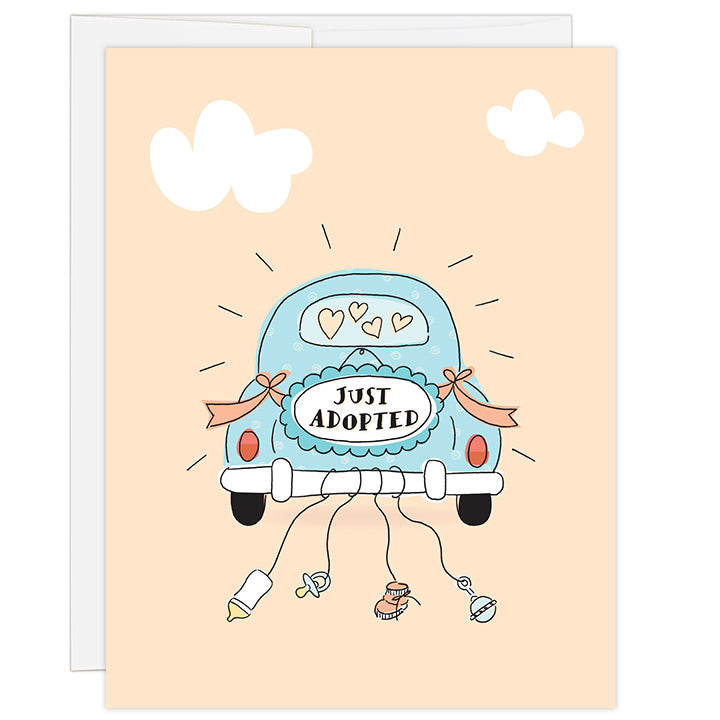 4.25 x 5.5 inch adoption greeting card. Blank inside. Simple and charming illustration style. Sign on back of a light blue antique car that reads JUST ADOPTED. Strings hang from the back bumper of the car with a baby bottle, pacifier, baby bootie and baby rattle.