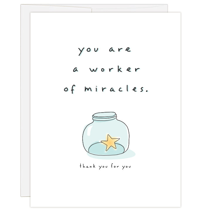 4.25 x 5.5 inch greeting card. Blank inside.  White cover with line illustration of a small blue-tinted jar holding a yellow star. Text: you are a worker of miracles. thank you for you