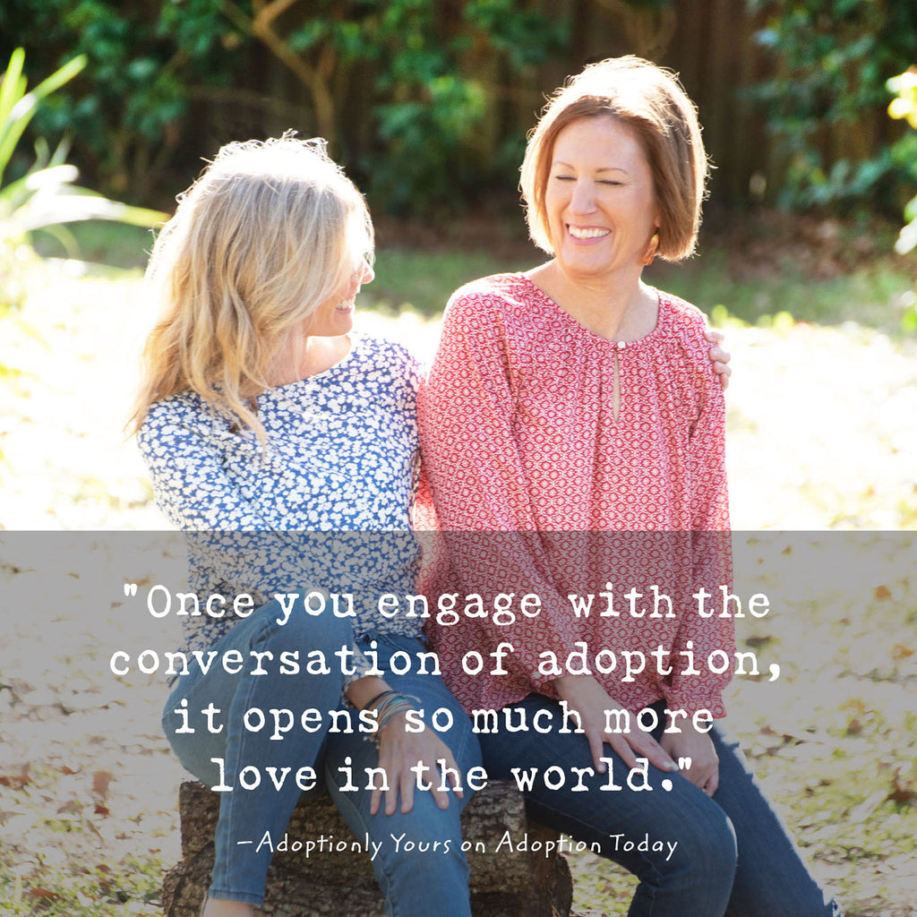 Co-founders of Adoptionly Yours, Stacy and Jayne sit on a log in the sunshine talking and smiling. Quote overlaying the photograph reads: "Once you engage with the conversation of adoption, it opens so much more love in the world." 