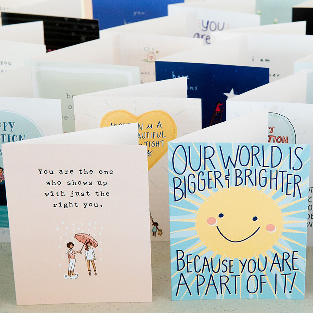 Photograph of a collection standing cards with messages for celebrating National Adoption Month.