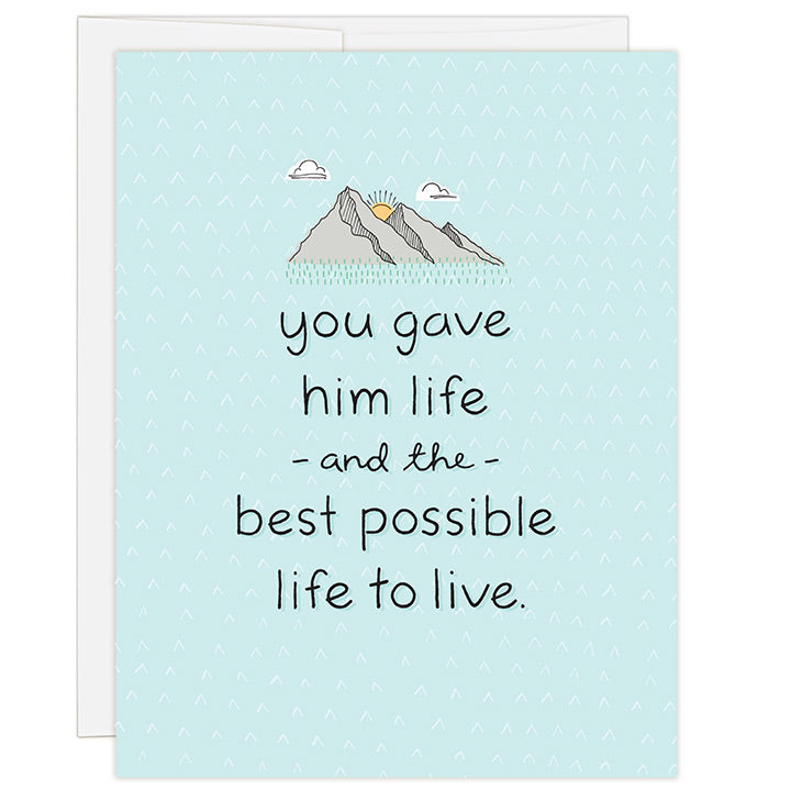 4.25 x 5.5 inch adoption greeting card for honoring a birth parent. Blank inside. Simple and charming illustration style. Light Blue background with small mountain range illustration above title. Title You Gave Him Life and the Best Possible Life to Live.