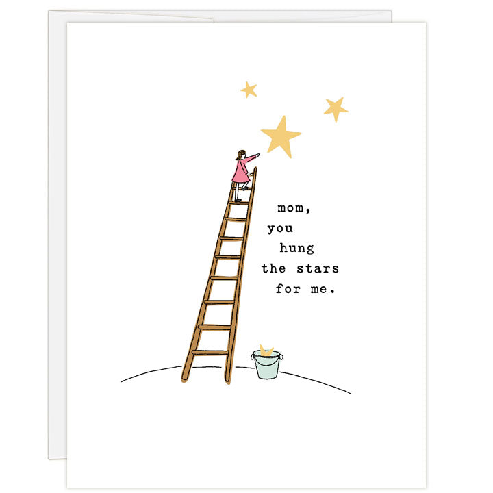 Line illustration on white, this Mother's Day card features a woman climbing a ladder to the stars, with a bucket of stars at the foot of the ladder and stars in the sky. Text: mom, you hung the stars for me.